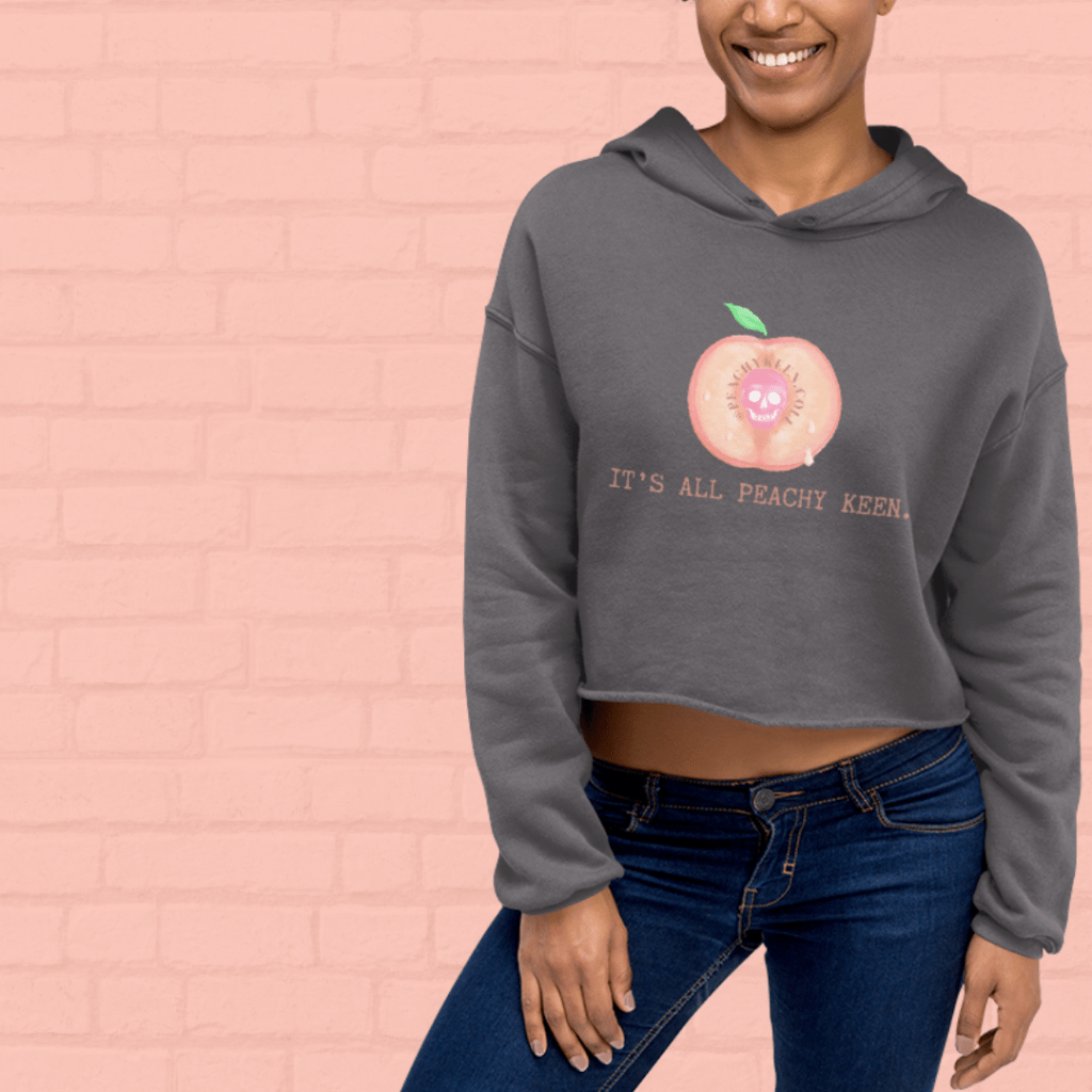 gray cropped hoodie with large peach that says "it's all peachy keen"